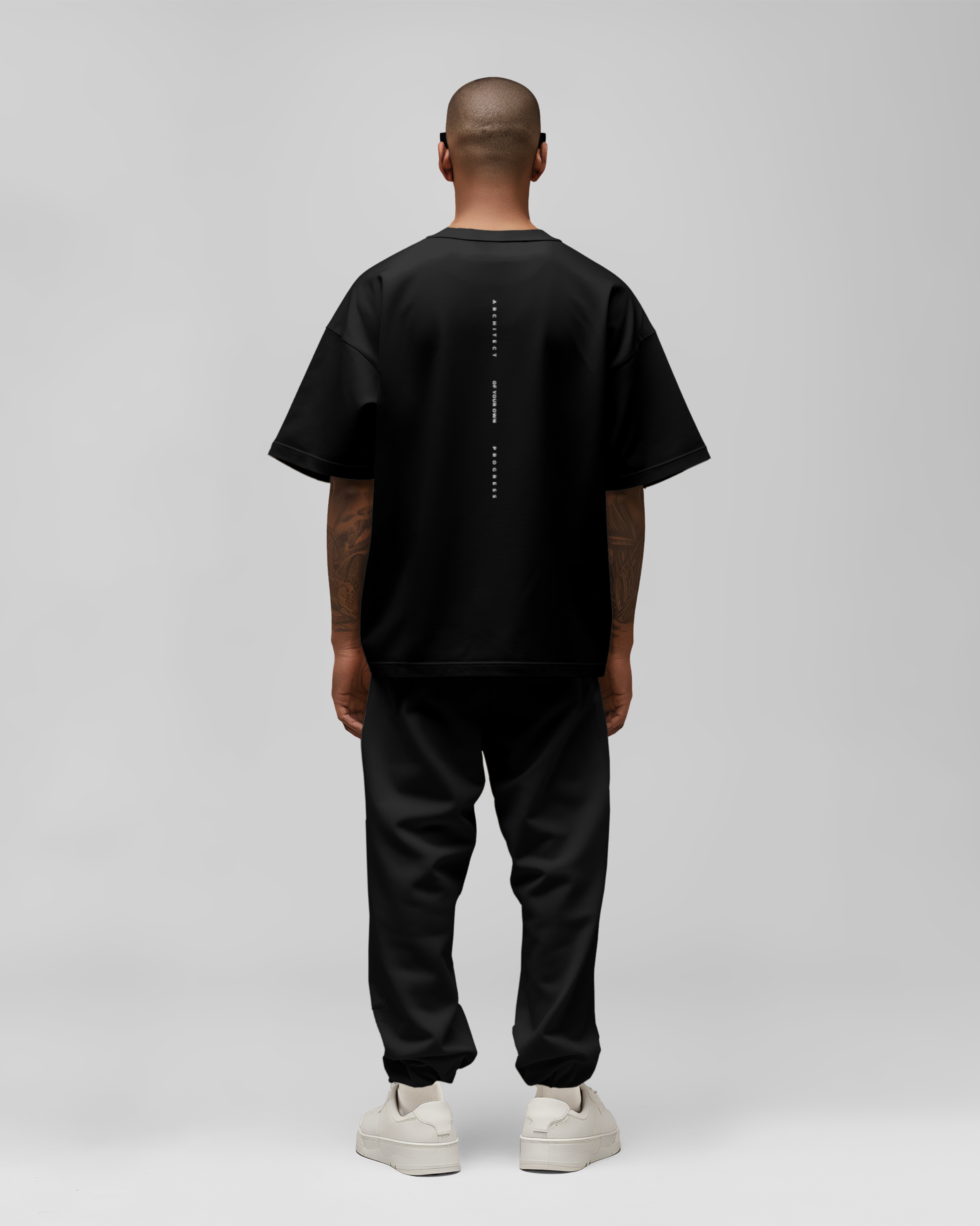 Model wearing black oversized t-shirt
